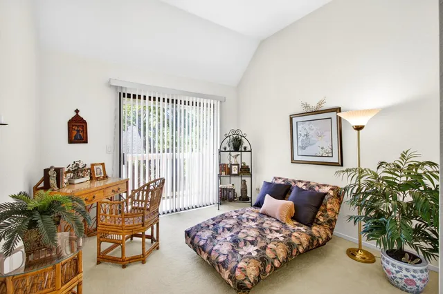 a bathroom with a double vanity sink a mirror and a bathtub
