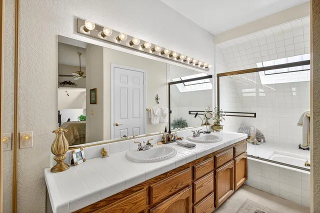 a room with lots of furniture and a chandelier