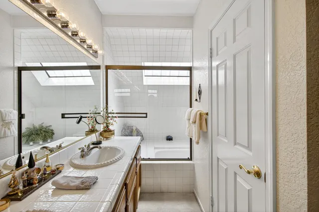 a kitchen with sink cabinets and wooden floor