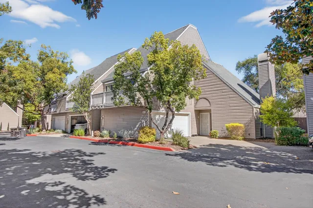 a view of a livingroom with workspace and a couch