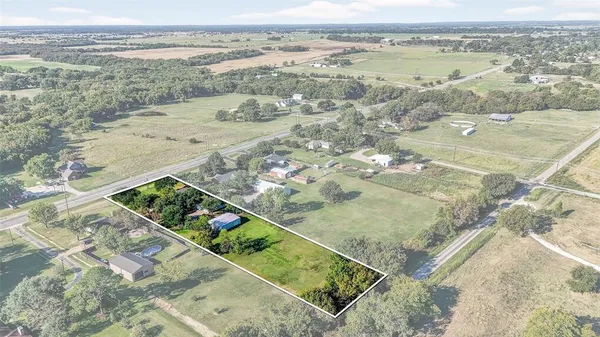 a view of a lake with a yard