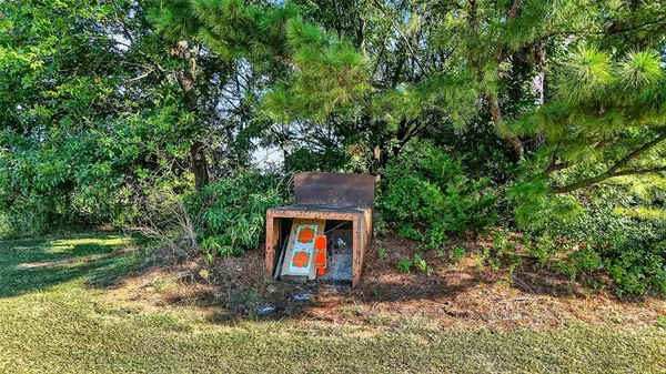 a kitchen with a white cabinets and window
