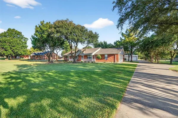 a kitchen with stainless steel appliances a white stove top oven sink and cabinets