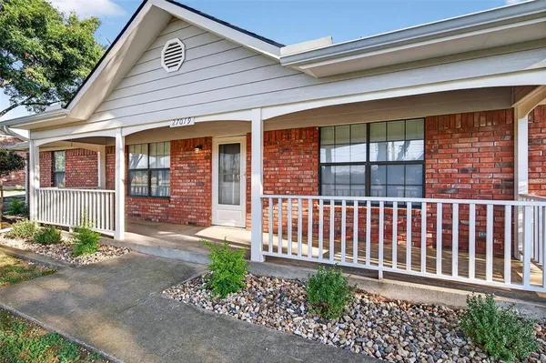 a porch with seating space
