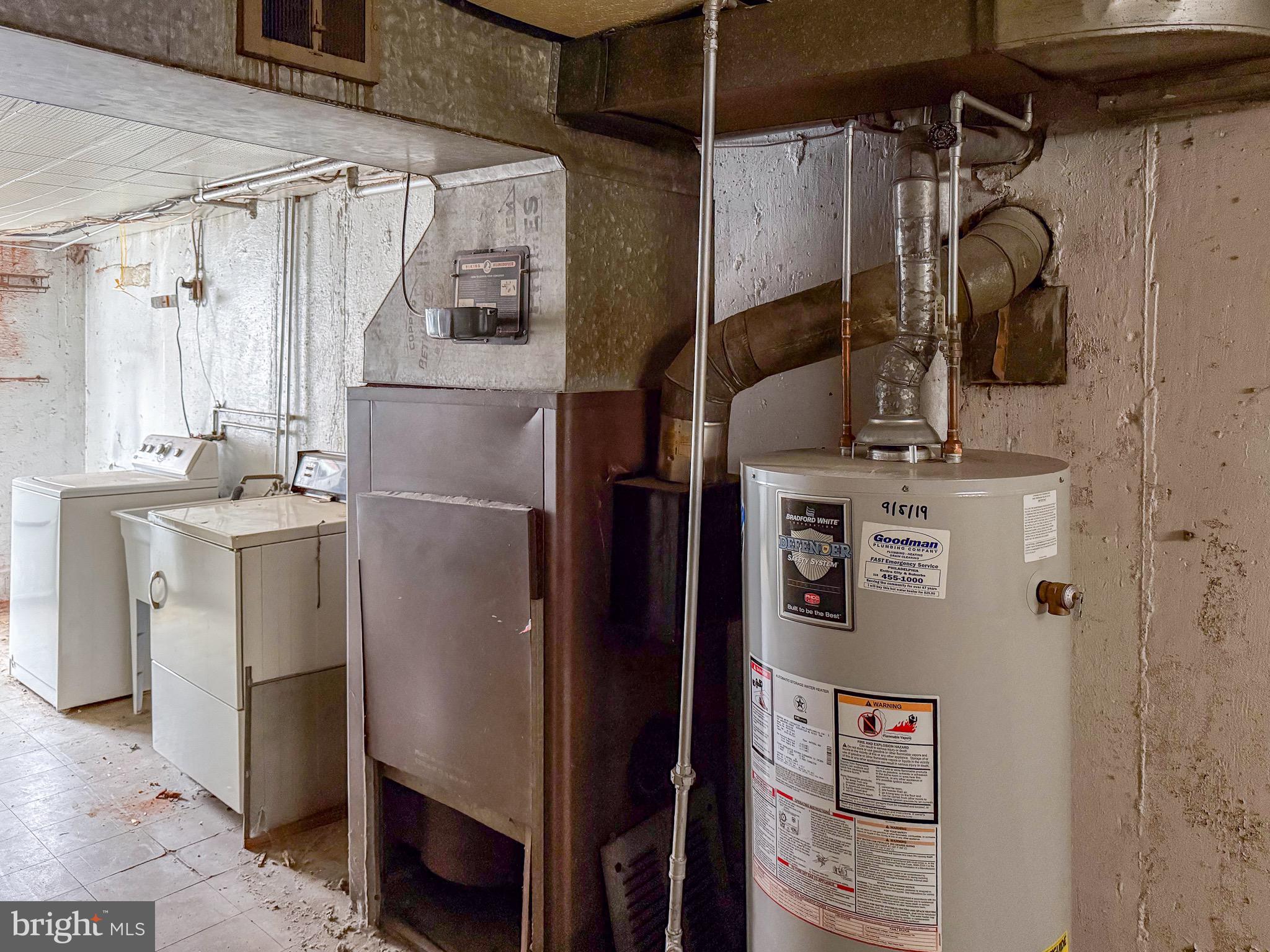 6333 Cottage Street Philadelphia, PA 19135 - Photo 20 of 23 a close view of a refrigerator and washer & dryer