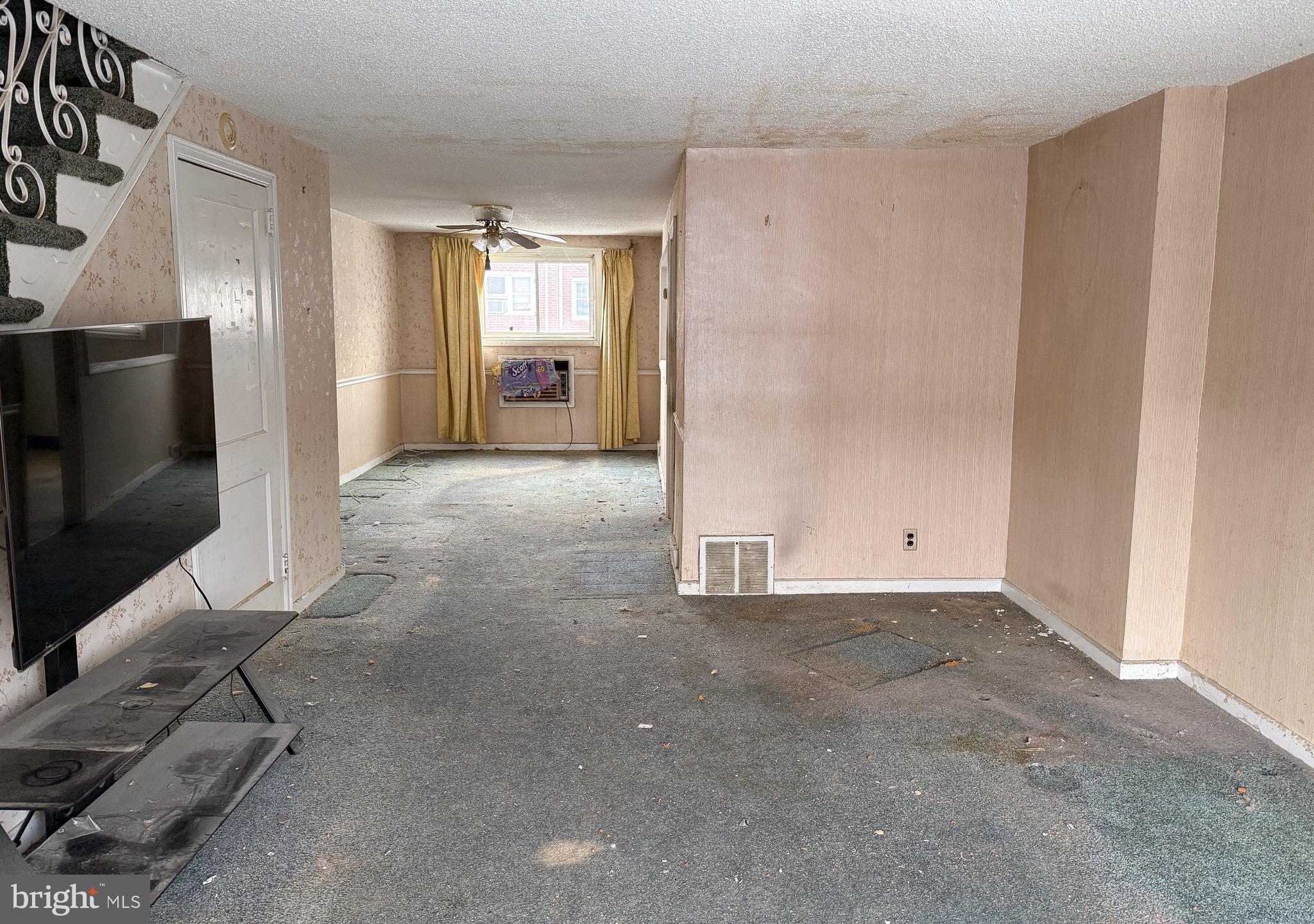 6333 Cottage Street Philadelphia, PA 19135 - Photo 4 of 23 a view of a livingroom with wooden floor and a flat screen tv