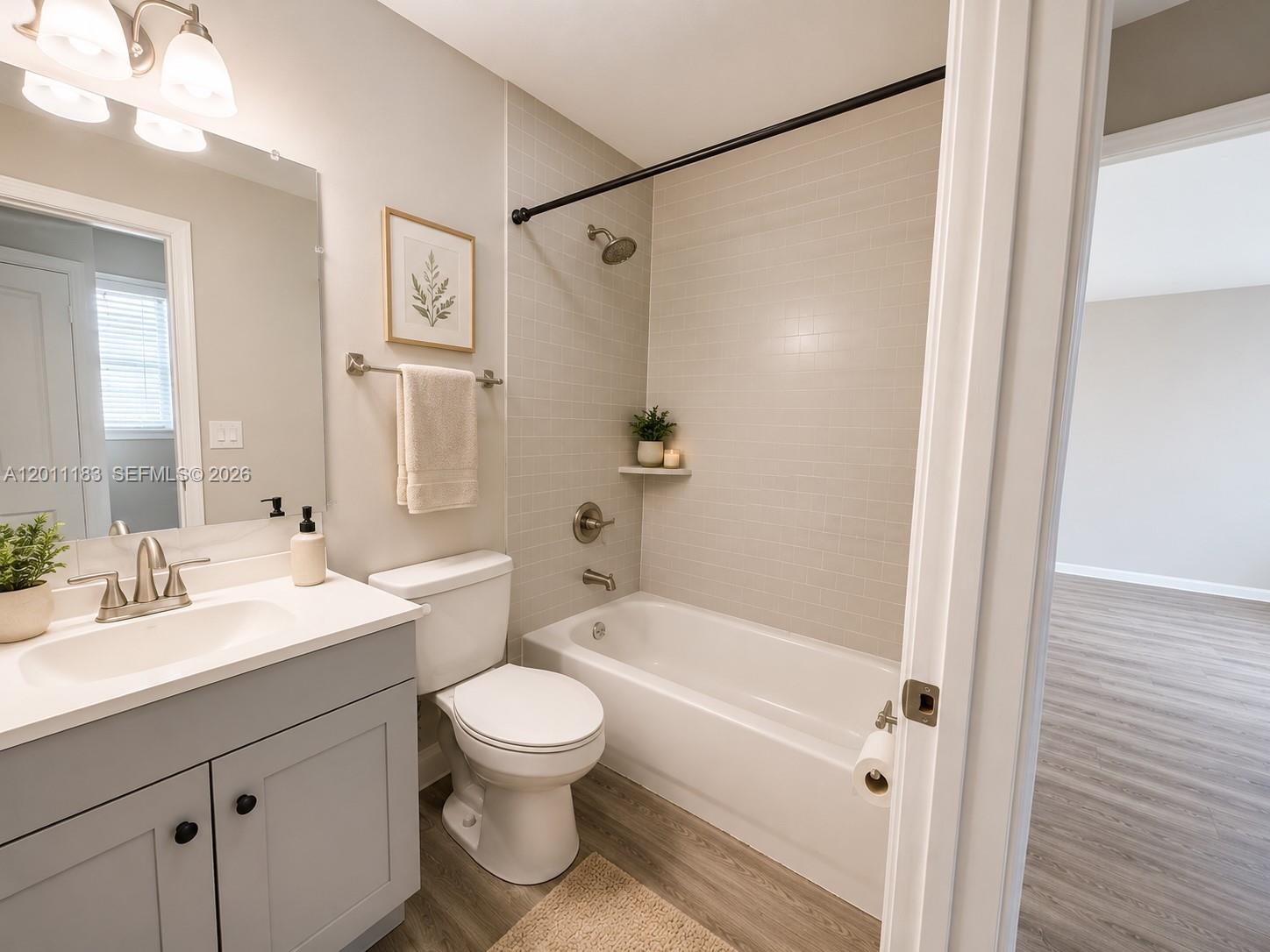 1208 South Ridgewood Avenue Daytona Beach, FL 32114 - Photo 5 of 27 a bathroom with a sink toilet and shower