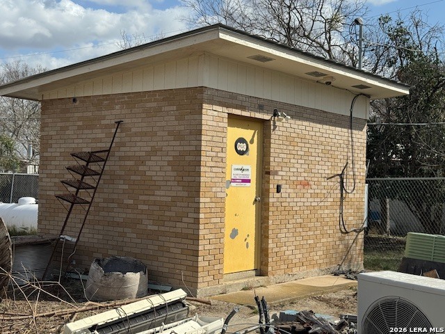 a front view of a house with iron fence