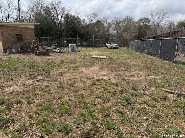 Tbd E Street Comfort, TX 78013 - Photo 6 of 9 a view of backyard with small cabin and wooden fence