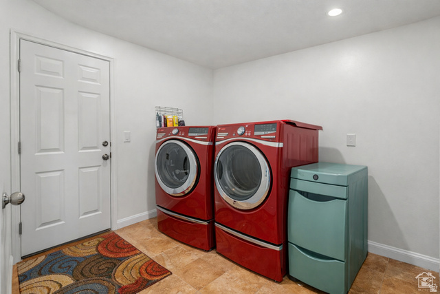 7092 Cherokee Street Eagle Mountain, UT 84005 - Photo 11 of 27 Utility room featuring a paneled door, tile flooring, and recessed lighting