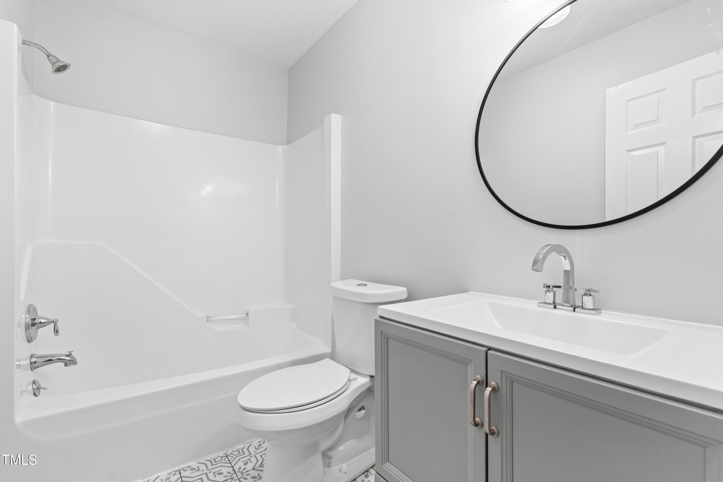 1212 Pender Street Raleigh, NC 27610 - Photo 9 of 19 a bathroom with a sink toilet and shower