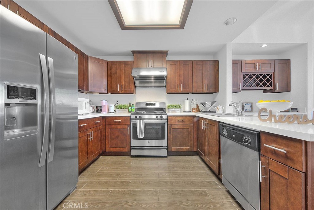 11 South 3rd Street, Unit 226 Alhambra, CA 91801 - Photo 13 of 25 a kitchen with granite countertop a sink stainless steel appliances and cabinets
