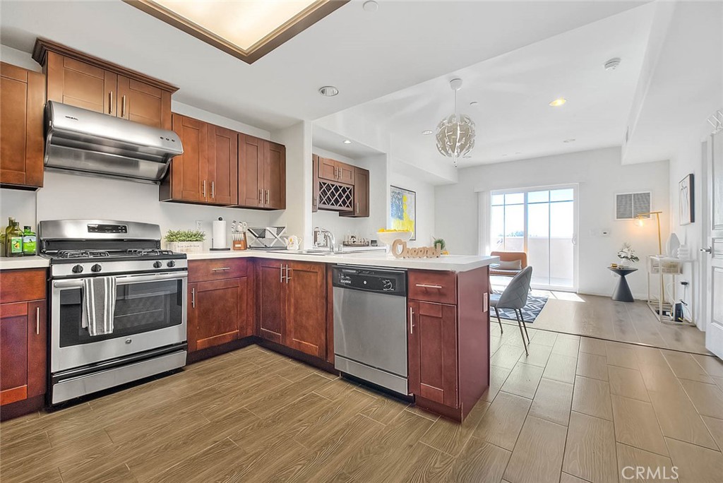 11 South 3rd Street, Unit 226 Alhambra, CA 91801 - Photo 14 of 25 a kitchen with stainless steel appliances granite countertop a stove a sink dishwasher and a refrigerator