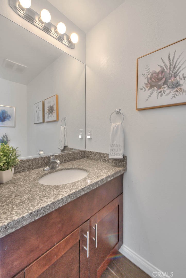11 South 3rd Street, Unit 226 Alhambra, CA 91801 - Photo 22 of 25 a bathroom with a granite countertop sink and a mirror