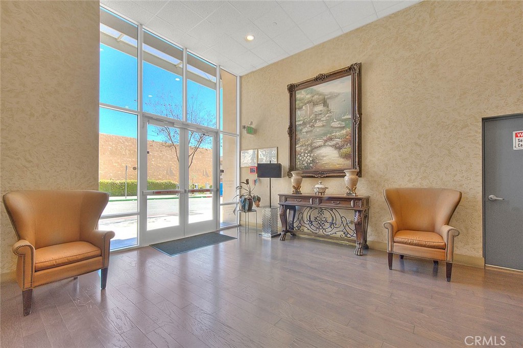 11 South 3rd Street, Unit 226 Alhambra, CA 91801 - Photo 8 of 25 a living room with furniture and a large window