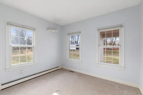 a bathroom with a sink toilet vanity and tub