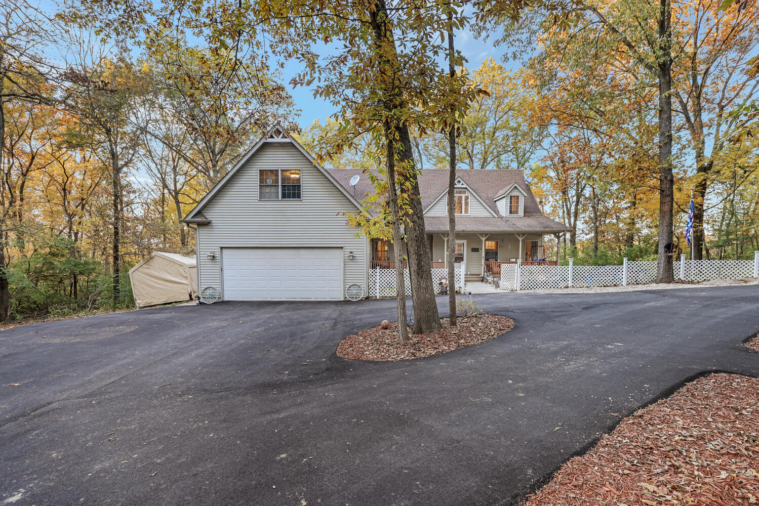 1 River Vly Rnch Road White Heath, IL 61884 - Photo 1 of 66 a front view of a house with a yard and garage