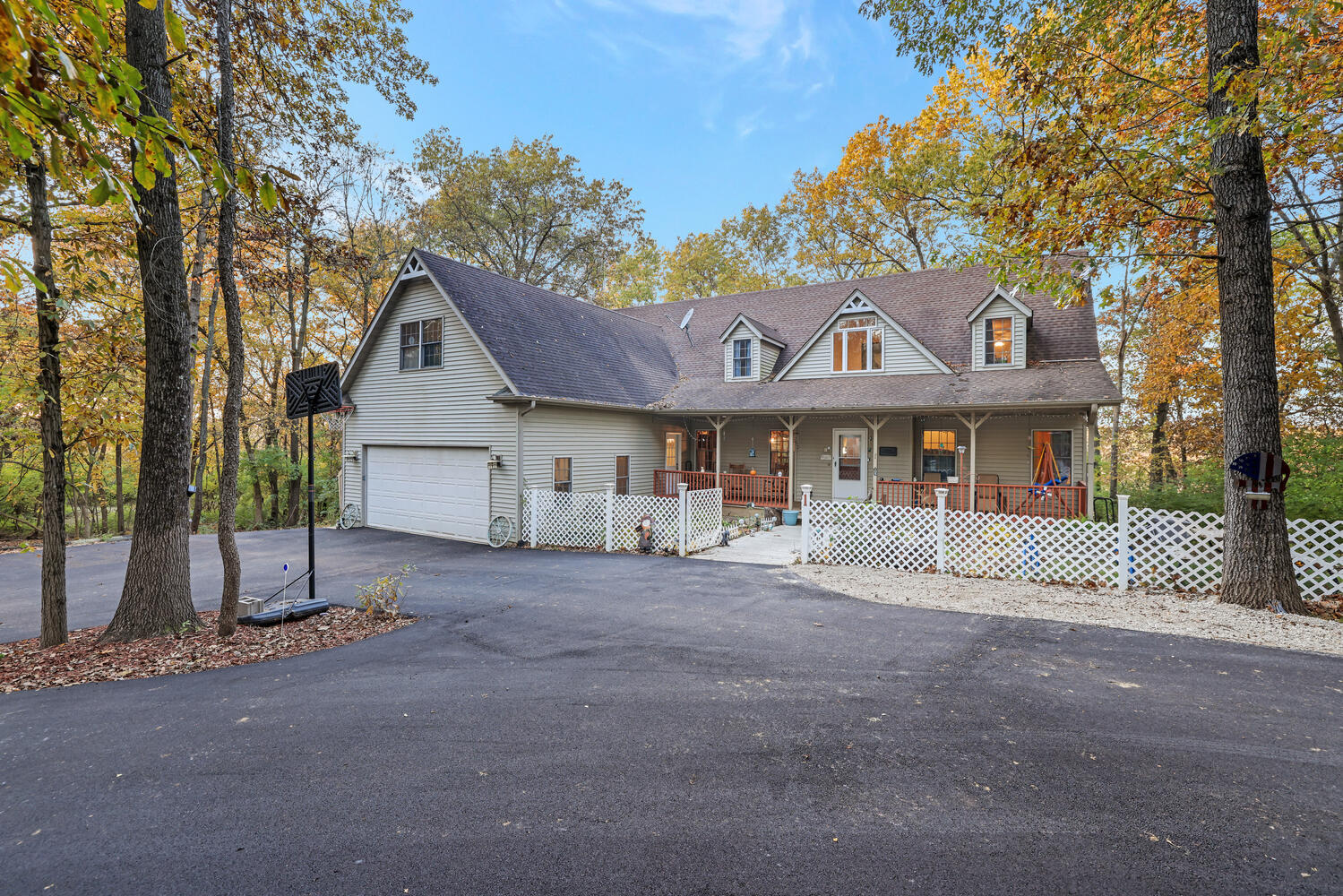 1 River Vly Rnch Road White Heath, IL 61884 - Photo 3 of 66 a front view of a house with a garden and trees