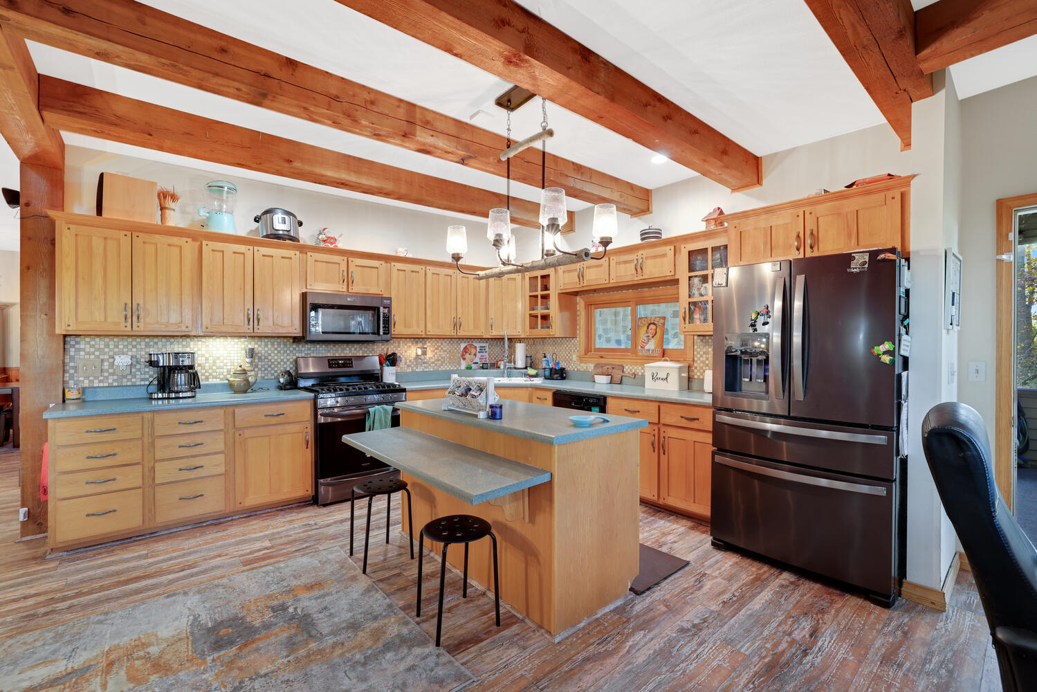 1 River Vly Rnch Road White Heath, IL 61884 - Photo 26 of 66 a kitchen with a refrigerator a stove top oven a sink dishwasher and white cabinets with wooden floor