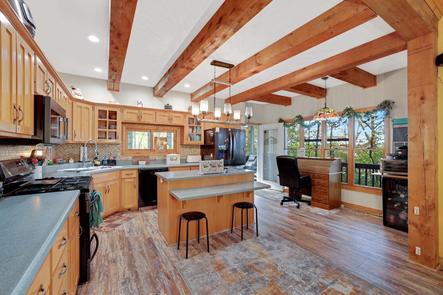 1 River Vly Rnch Road White Heath, IL 61884 - Photo 27 of 66 a kitchen with a sink a stove and chairs