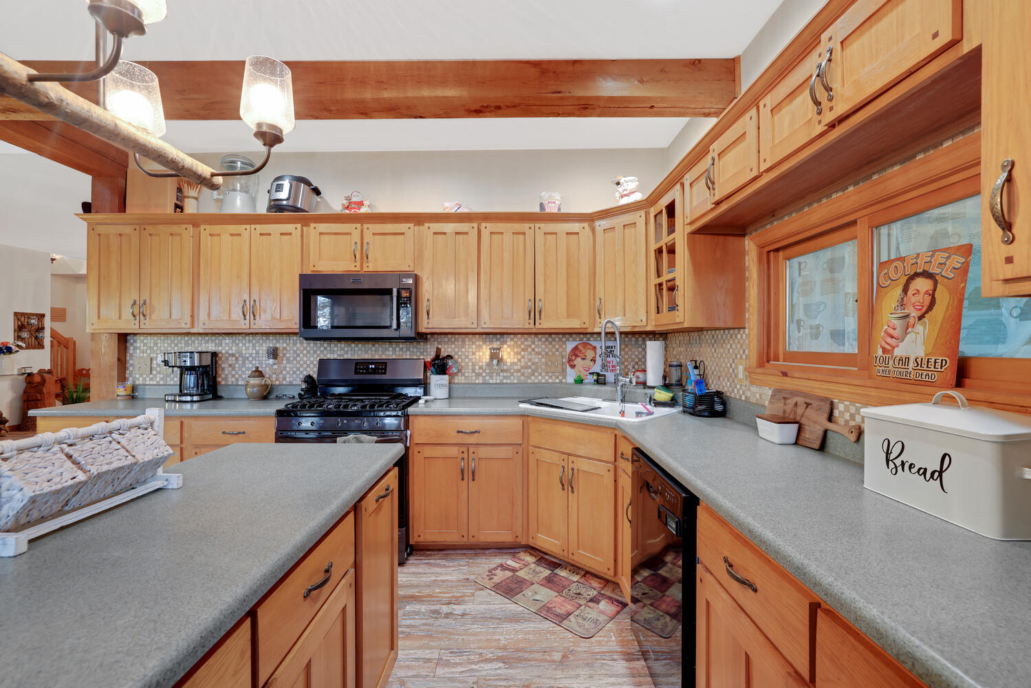 1 River Vly Rnch Road White Heath, IL 61884 - Photo 30 of 66 a kitchen with stainless steel appliances a sink a stove top oven a counter space and cabinets