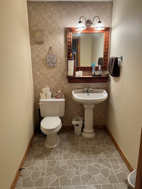 1 River Vly Rnch Road White Heath, IL 61884 - Photo 36 of 66 a bathroom with a toilet sink and mirror