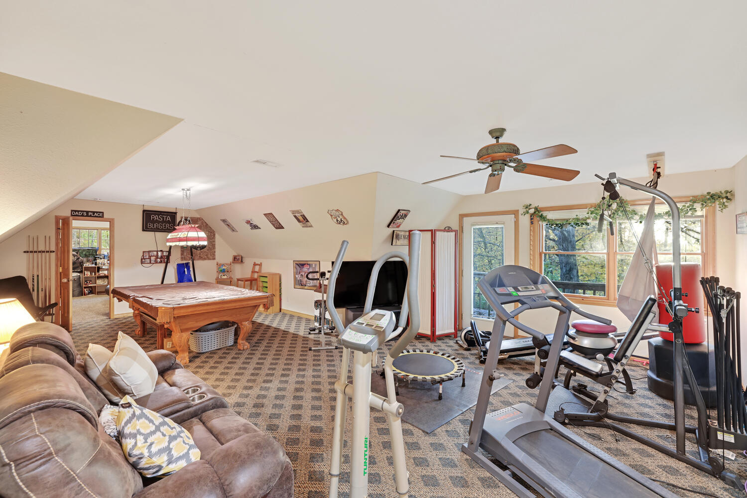 1 River Vly Rnch Road White Heath, IL 61884 - Photo 53 of 66 a living room with furniture a fireplace and a flat screen tv
