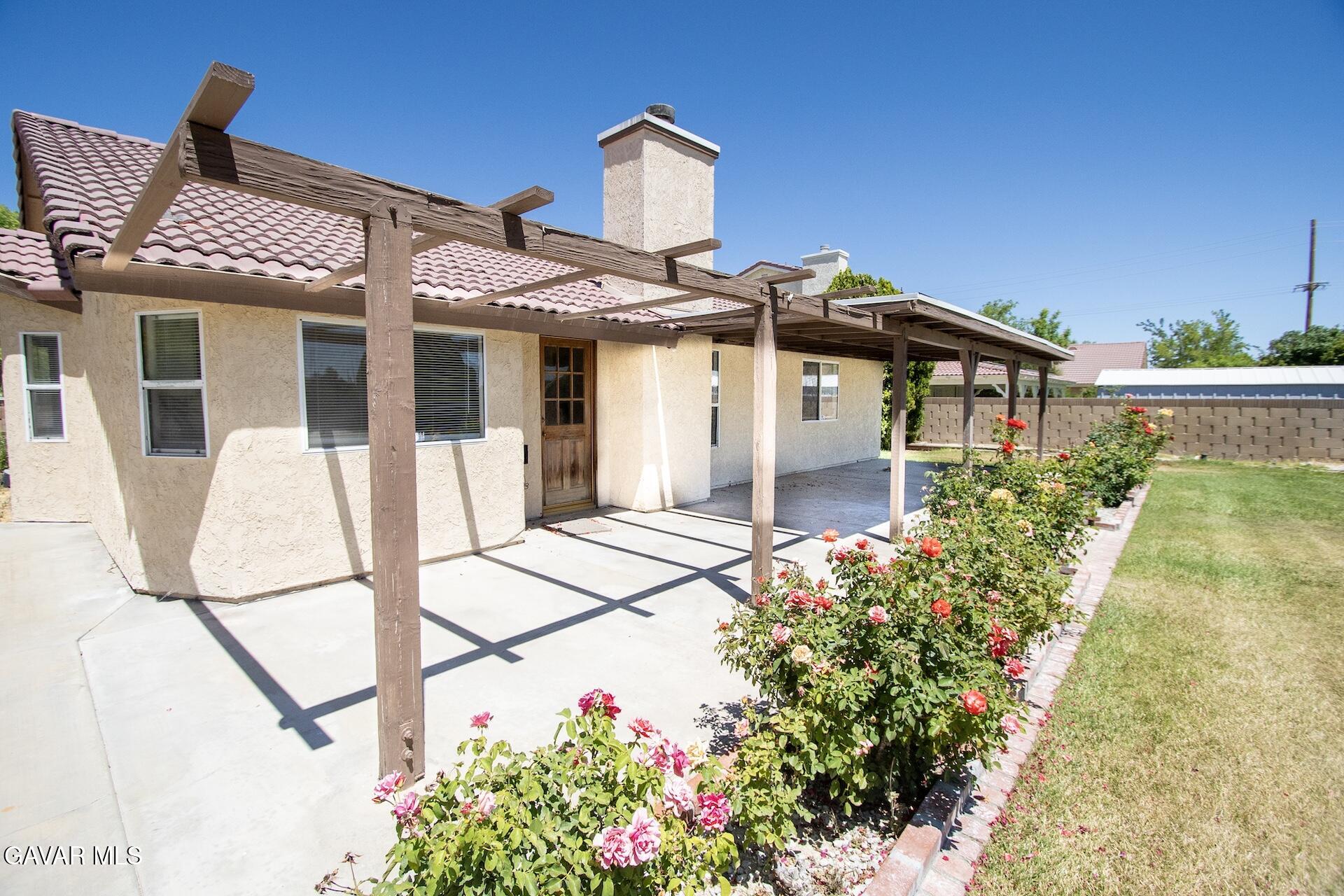 44318 33rd Street West Lancaster, CA 93536 - Photo 9 of 29 front view of a house with a small yard