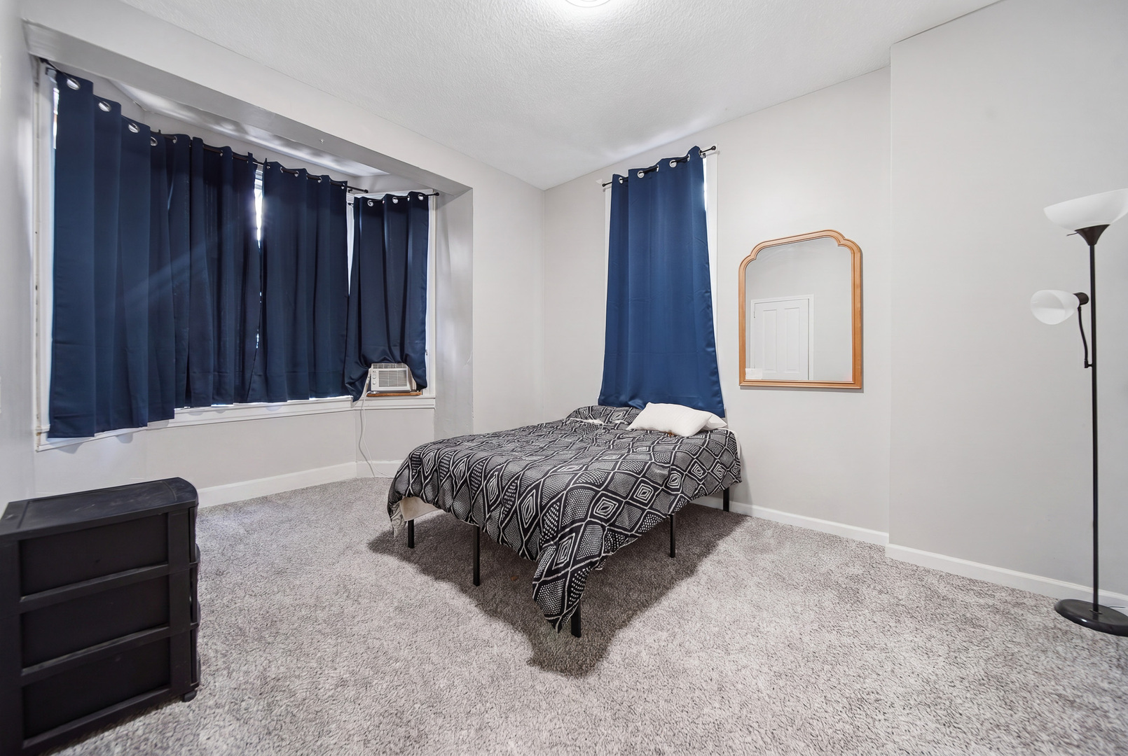 305 Monroe Avenue Dixon, IL 61021 - Photo 25 of 36 a bedroom with a bed and a dresser