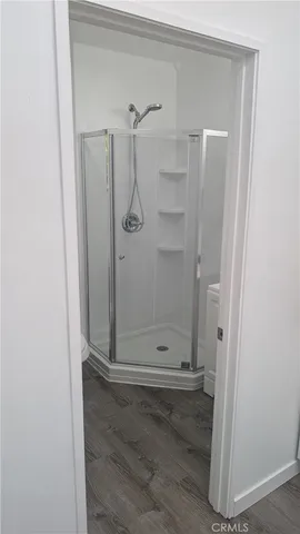 a view of a bathroom with wooden floor