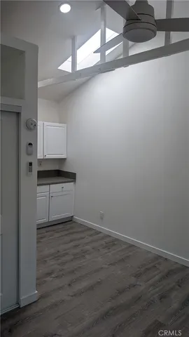 a view of a kitchen with wooden floor