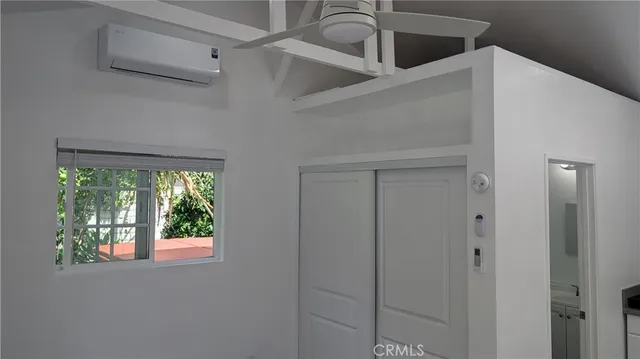 a kitchen with a window and cabinets