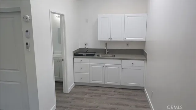 a view of cabinets and wooden floor