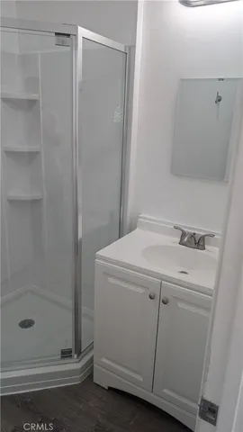 a bathroom with a shower and sink