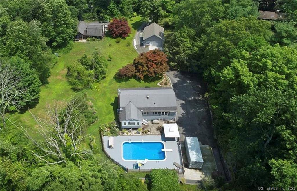 an aerial view of a house with outdoor space pool seating area and entertaining space