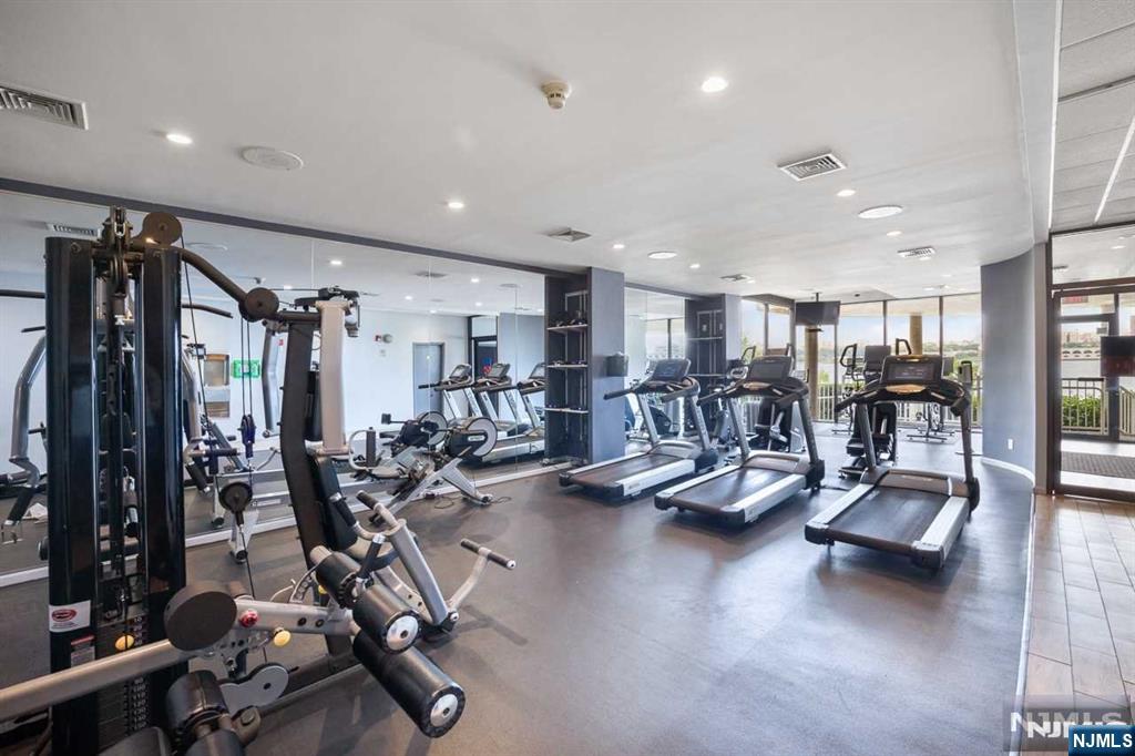 1055 River Road, Unit 905 Edgewater, NJ 07020 - Photo 24 of 26 a view of a room with gym equipment