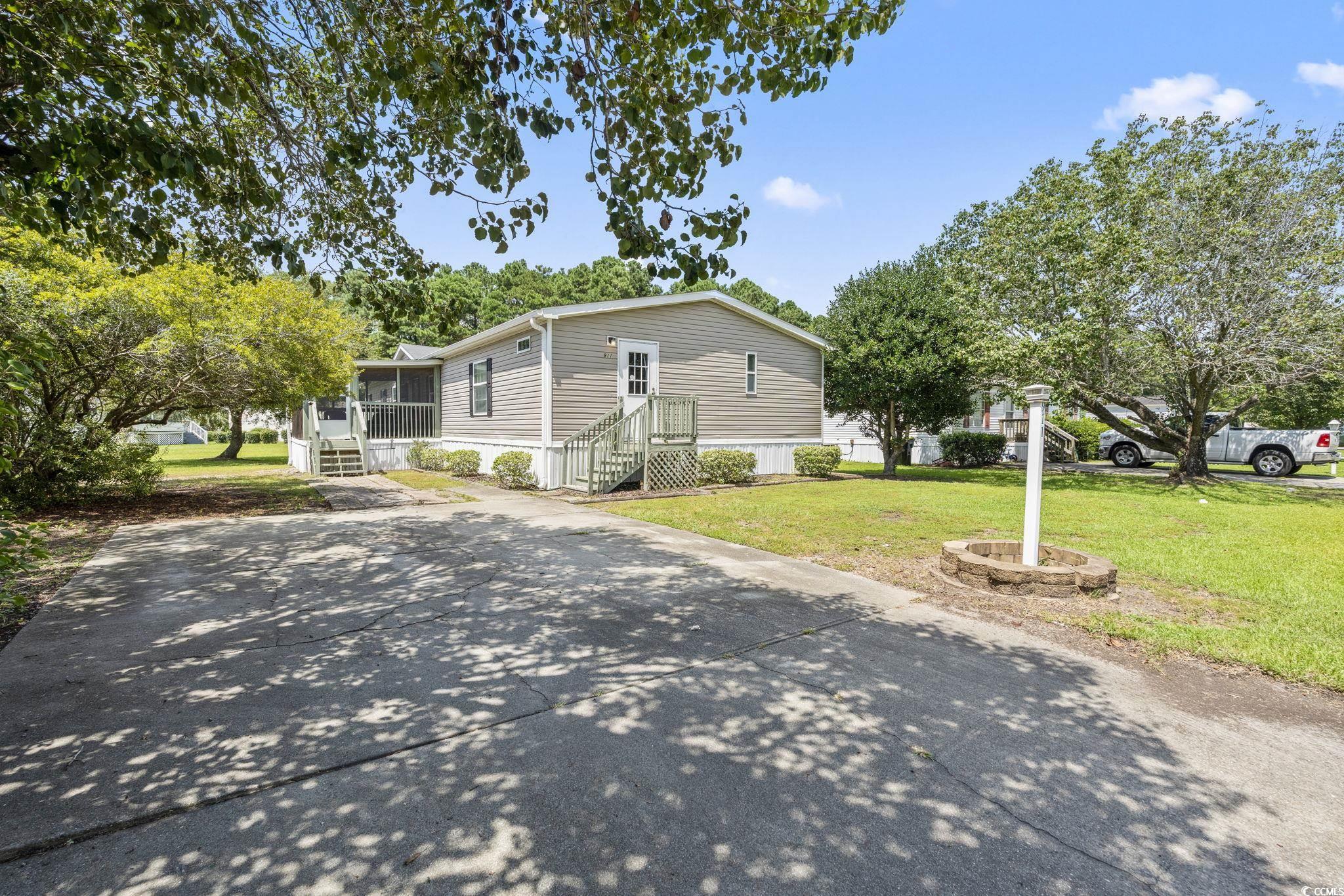 911 Old Magnolia Drive Conway, SC 29526 - Photo 2 of 35 Manufactured / mobile home featuring a front yard and a sunroom