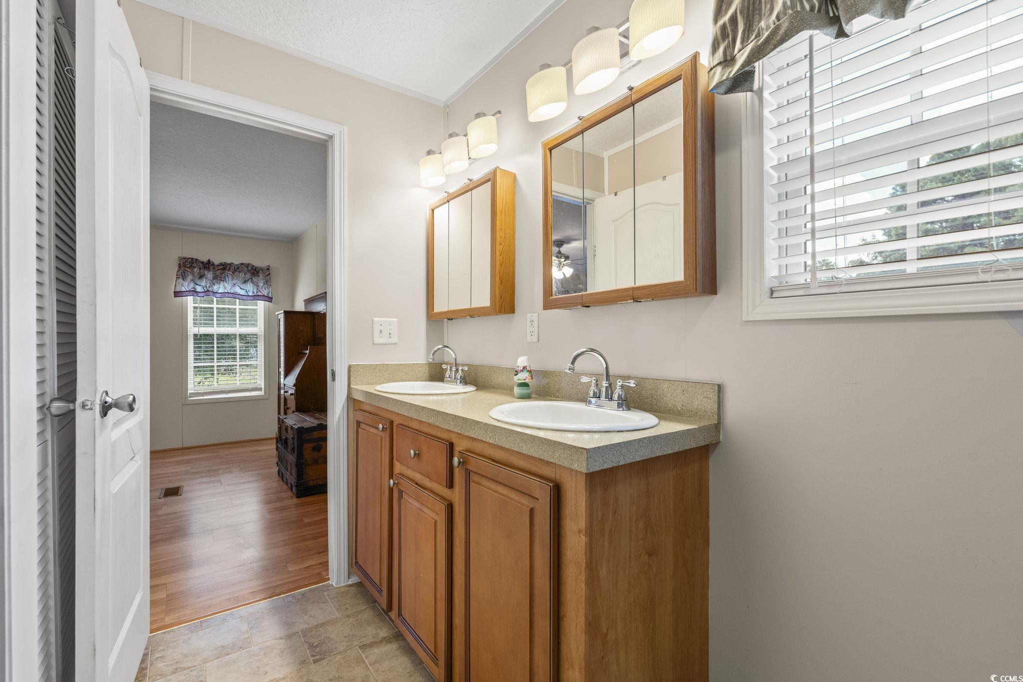 911 Old Magnolia Drive Conway, SC 29526 - Photo 20 of 35 Bathroom featuring double vanity and ornamental molding