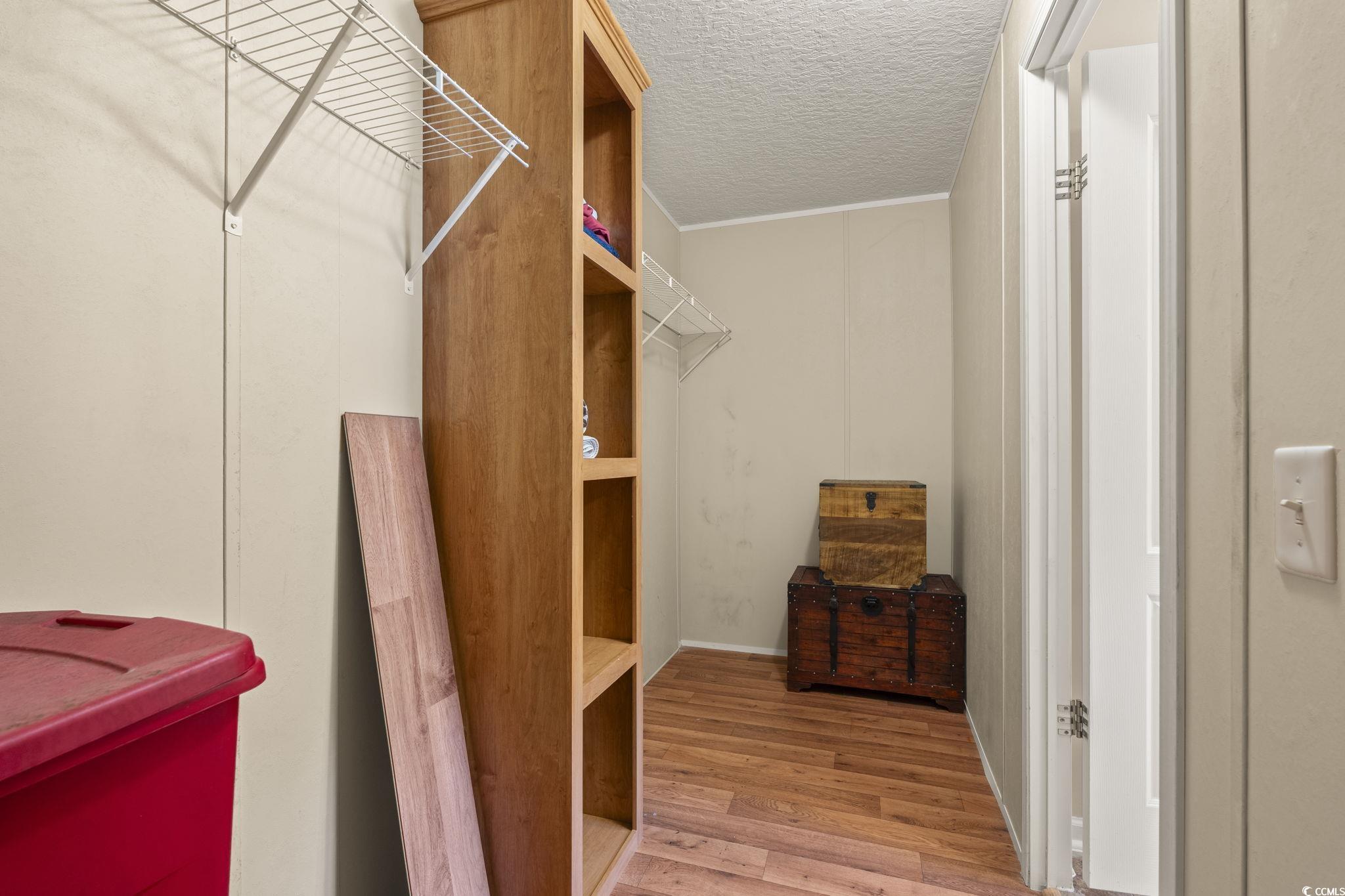 911 Old Magnolia Drive Conway, SC 29526 - Photo 23 of 35 Walk in closet featuring wood finished floors