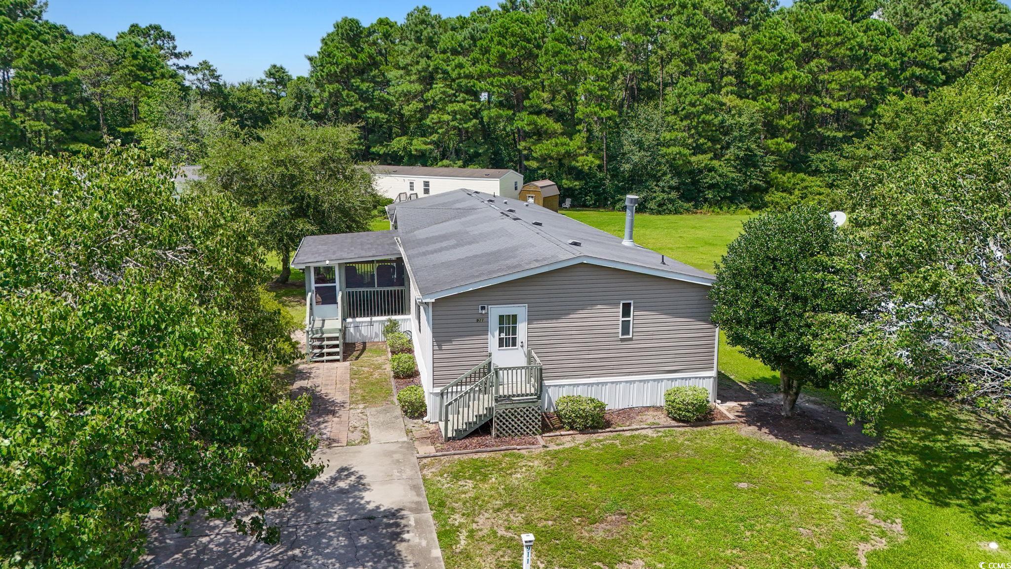911 Old Magnolia Drive Conway, SC 29526 - Photo 3 of 35 View of subject property with a forest
