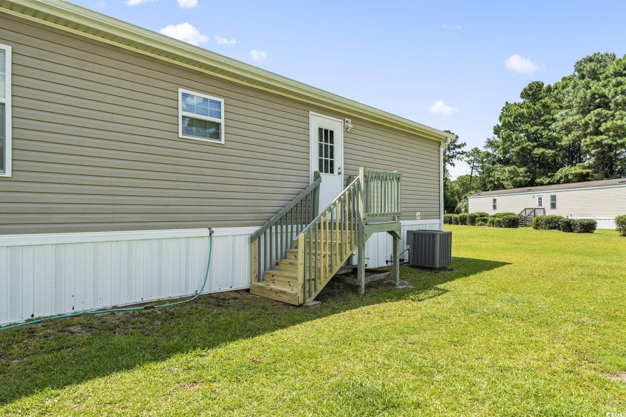 911 Old Magnolia Drive Conway, SC 29526 - Photo 31 of 35 Back of property featuring a yard