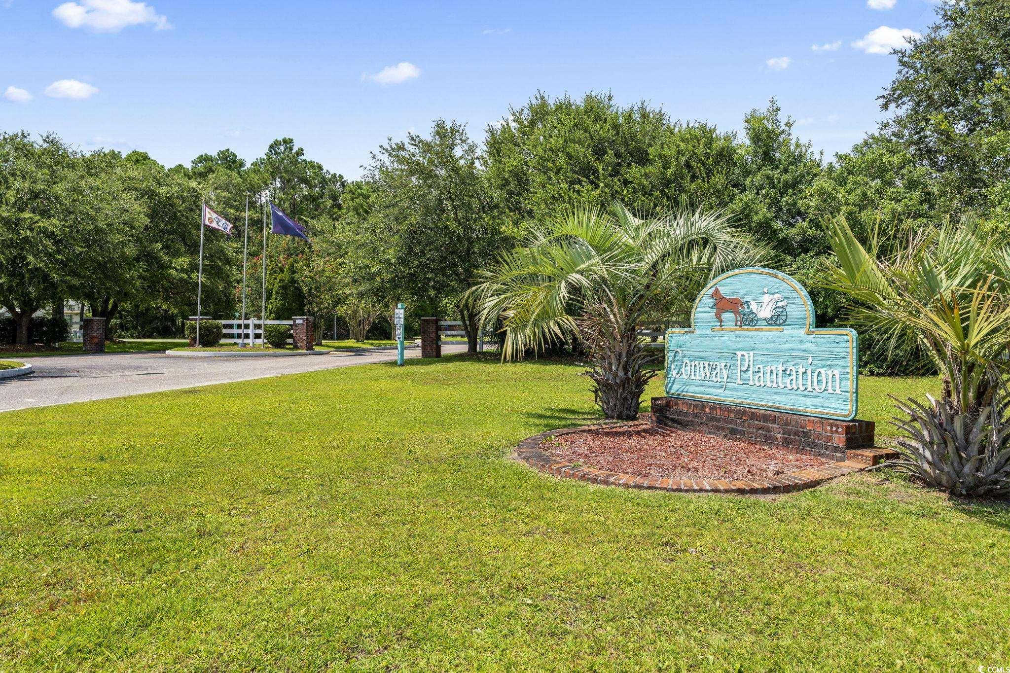 911 Old Magnolia Drive Conway, SC 29526 - Photo 32 of 35 View of property's community featuring a lawn and view of scattered trees