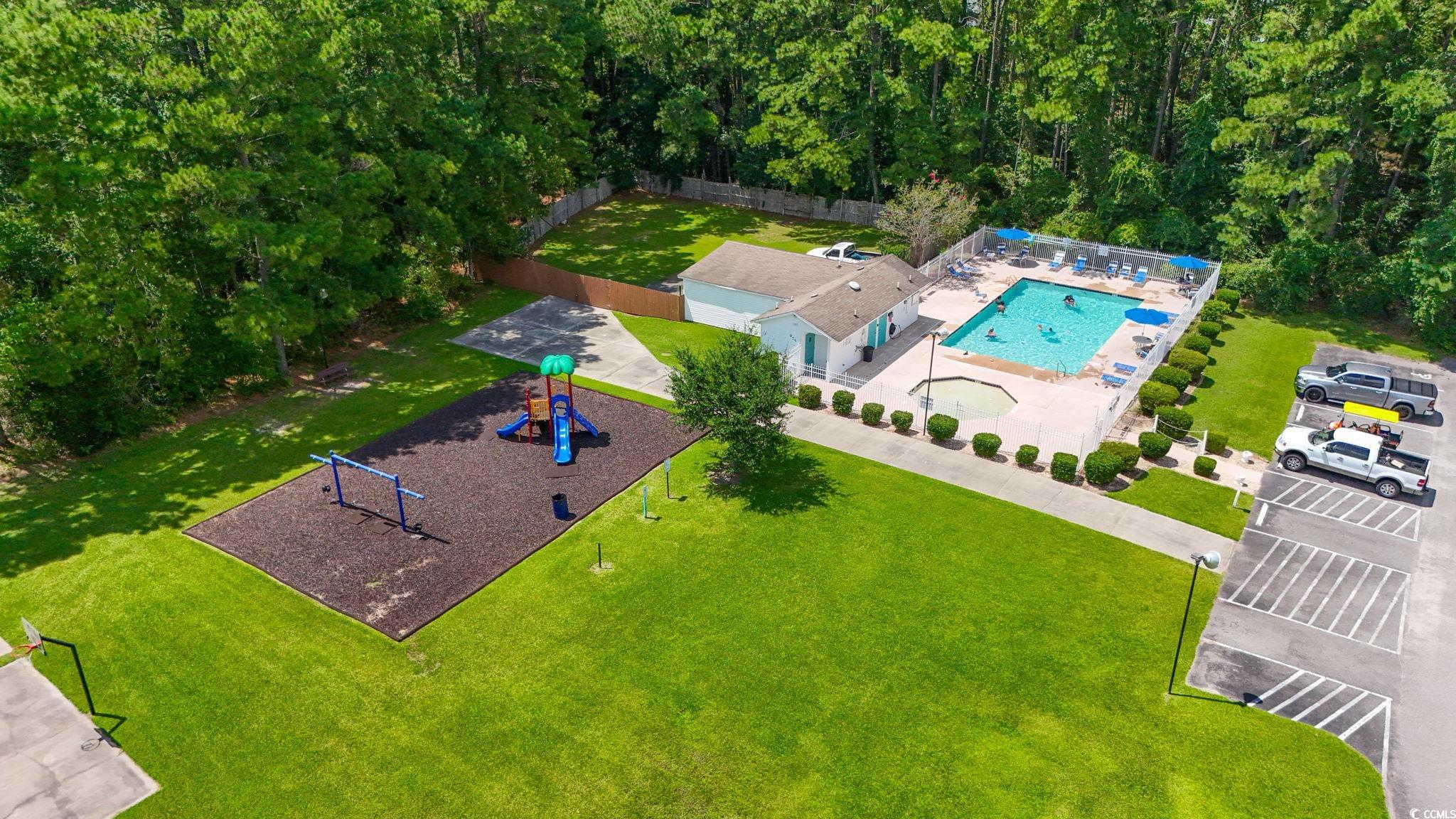 911 Old Magnolia Drive Conway, SC 29526 - Photo 4 of 35 Aerial view of a pool area and a forest
