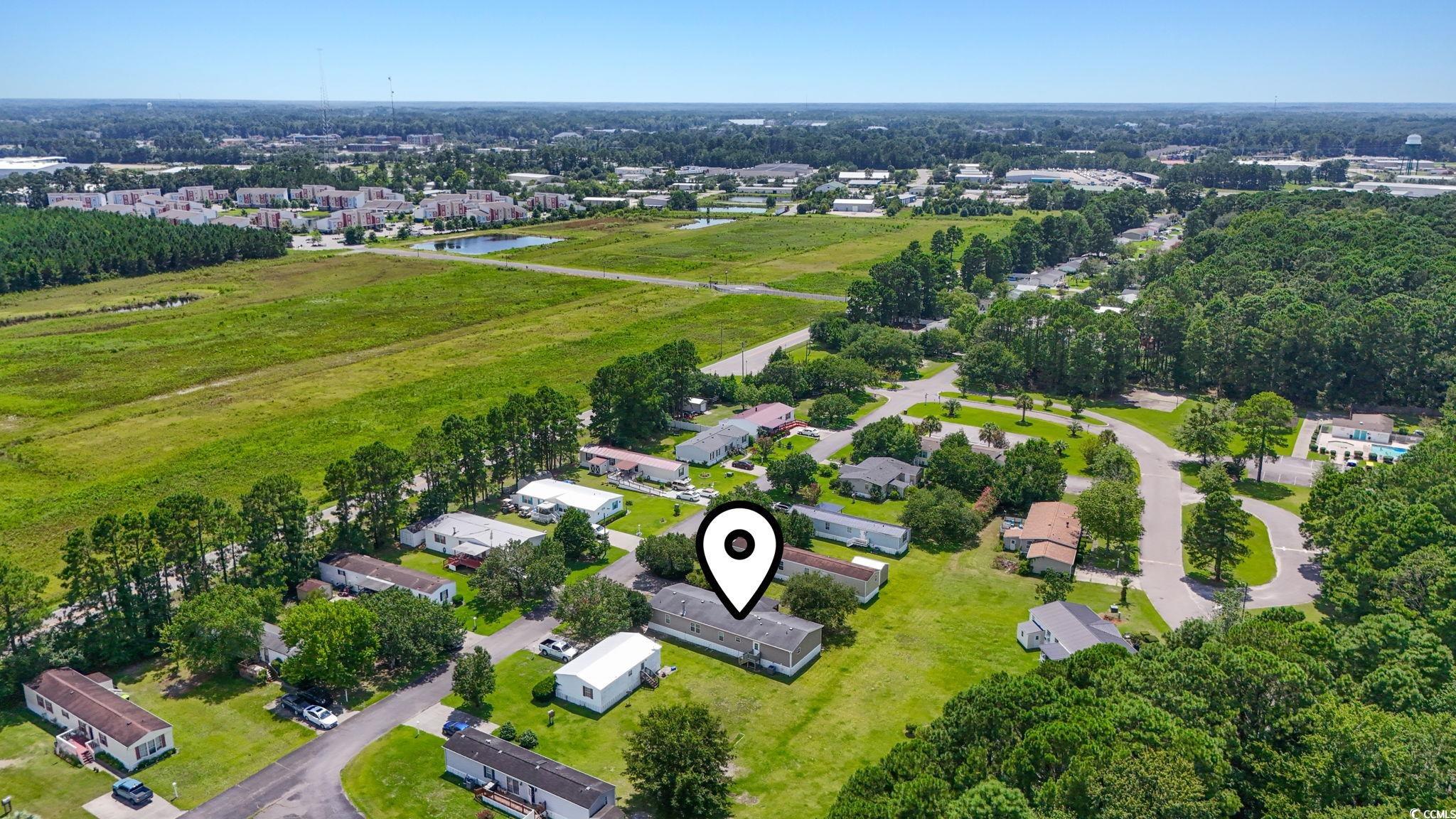 911 Old Magnolia Drive Conway, SC 29526 - Photo 7 of 35 Aerial perspective of suburban area featuring a nearby body of water