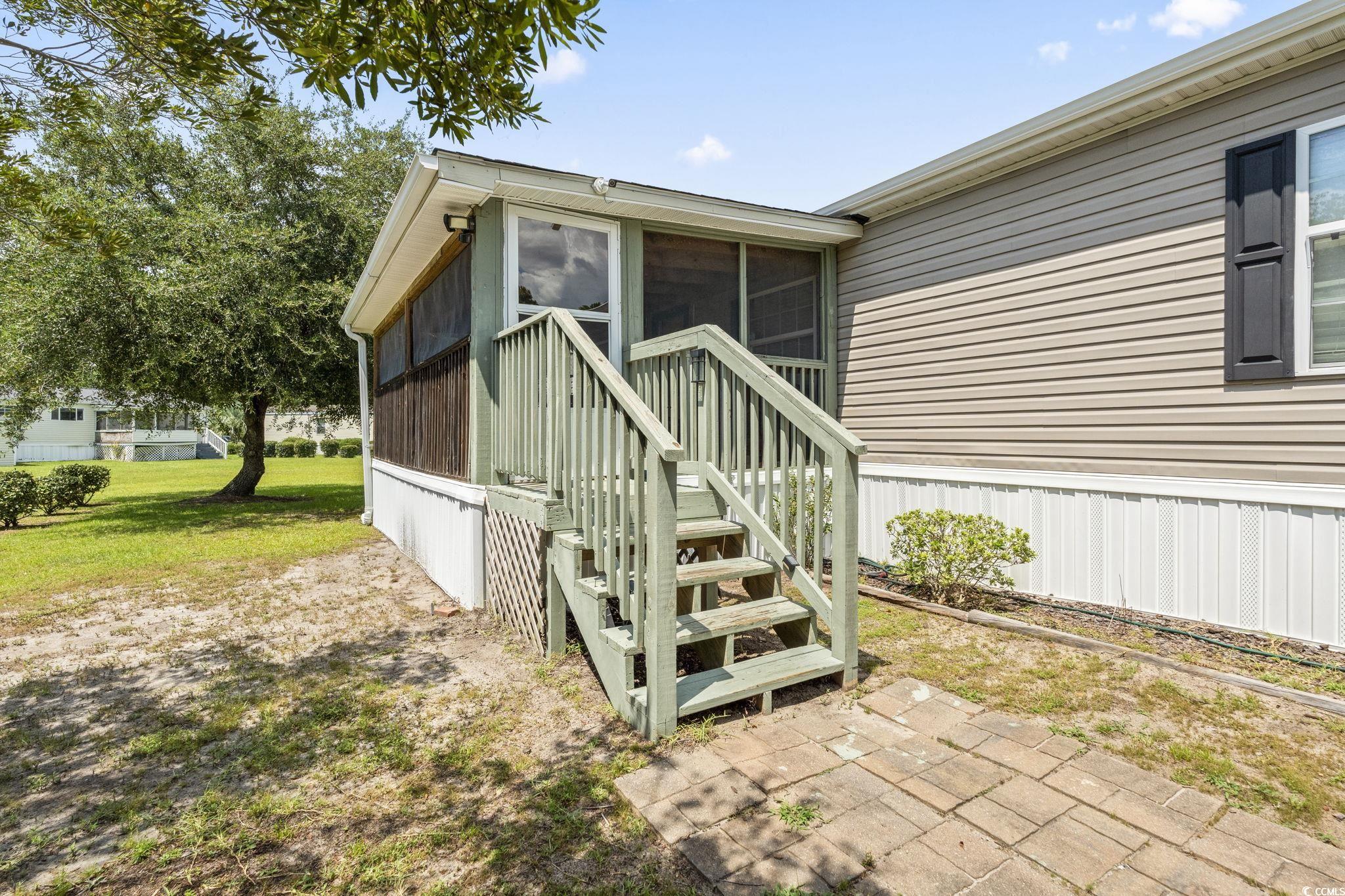 911 Old Magnolia Drive Conway, SC 29526 - Photo 9 of 35 Property entrance with a lawn