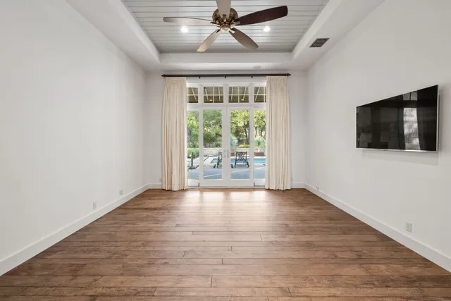 a spacious bathroom with a double vanity sink a mirror and a bathtub