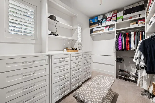 a view of storage and utility room with two washing machine