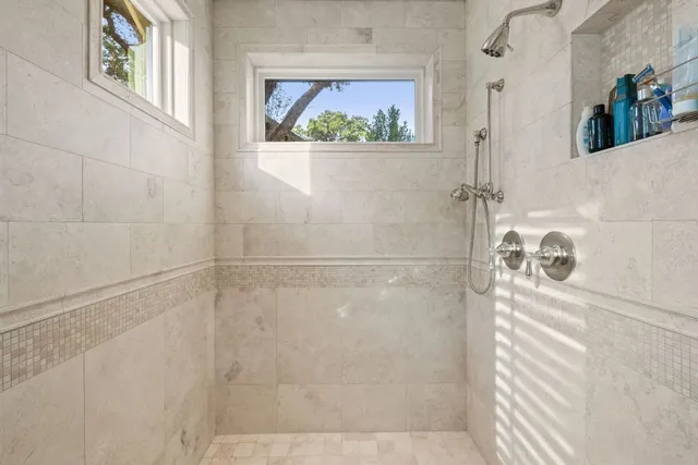 a bedroom with bed and a night stand