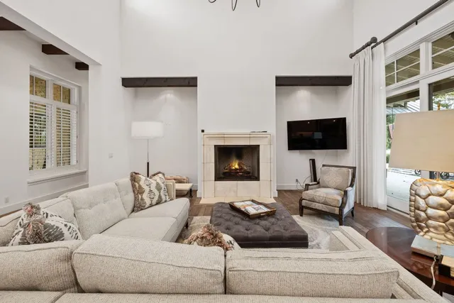 a kitchen with a dining table chairs sink and cabinets
