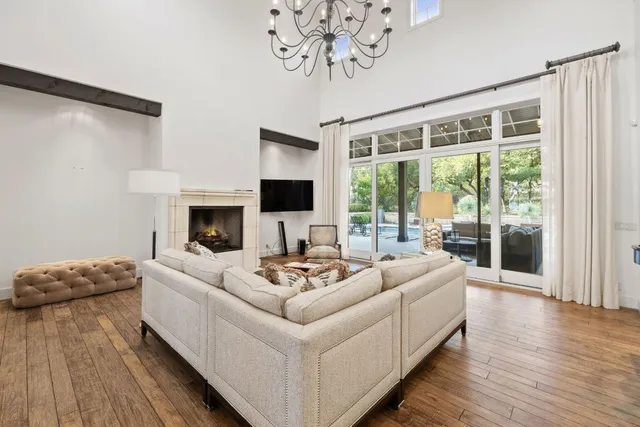 a kitchen with an oven a stove and white cabinets